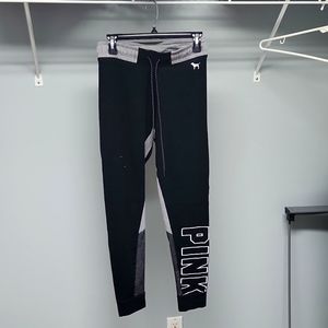 Pink Yoga leggings that have jogger bottoms, size medium black.